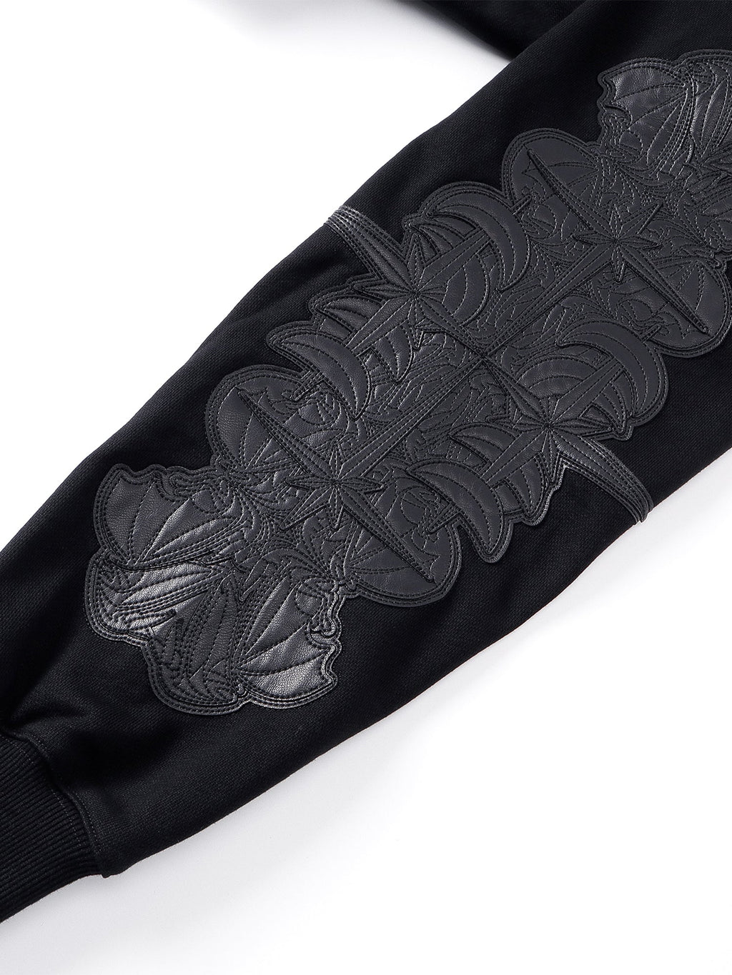Close-up of the Grey Blue hoodie chest patch and zipper.