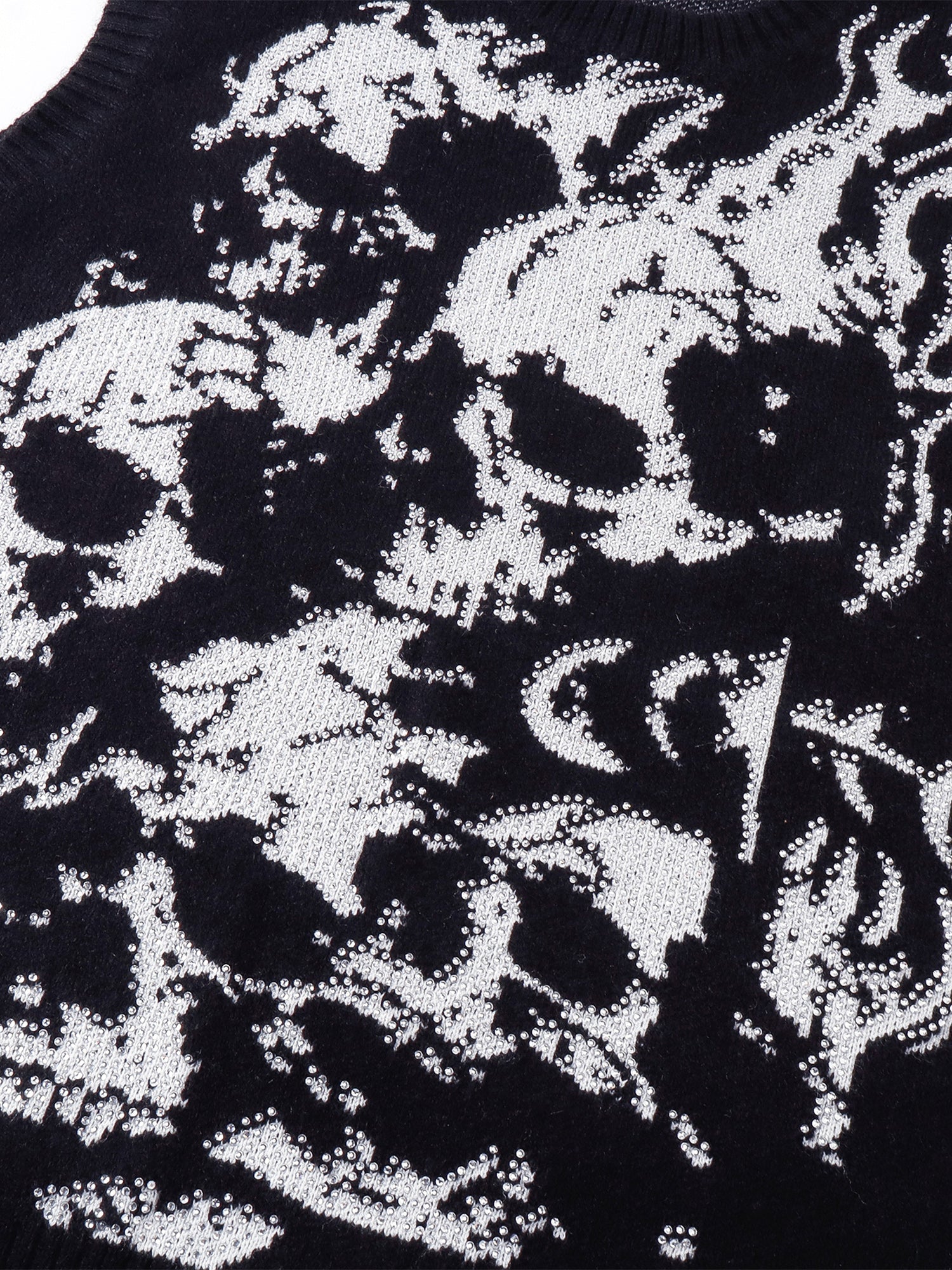 Close-up of the jacquard wraith motif and rhinestone detailing.
