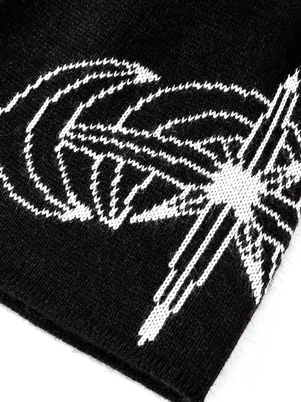White jacquard crescent motif on Black beanie, close-up