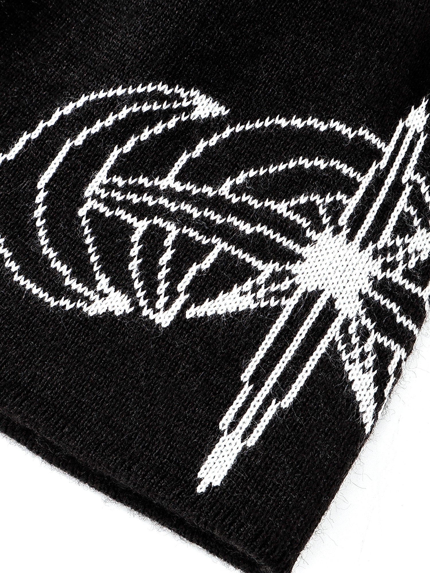 White jacquard crescent motif on Black beanie, close-up