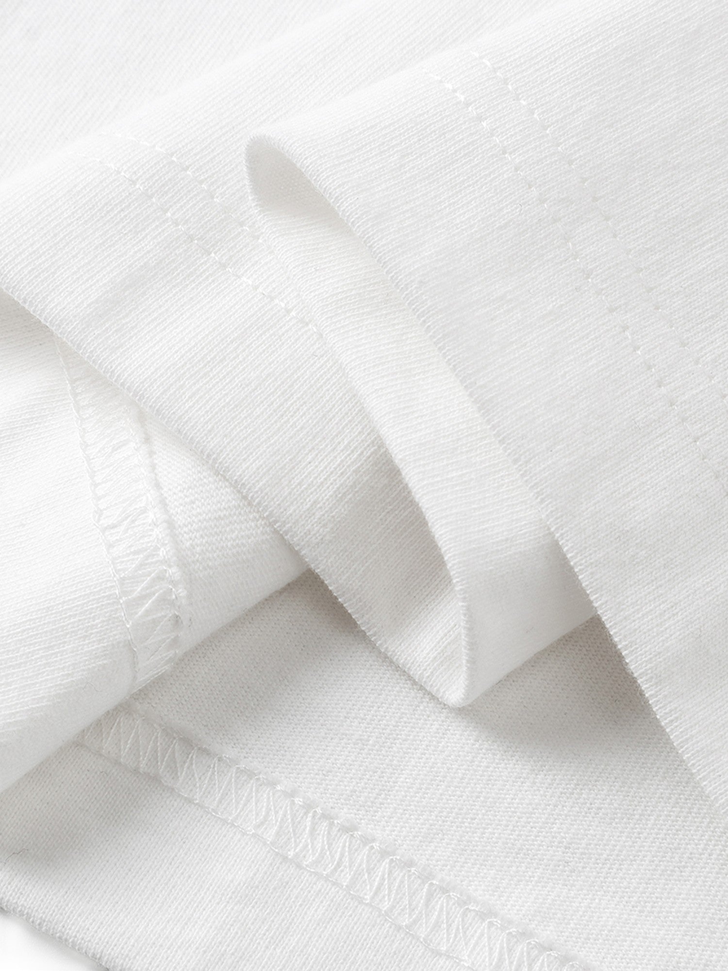 White long-sleeve tee hem and overlock seam detail