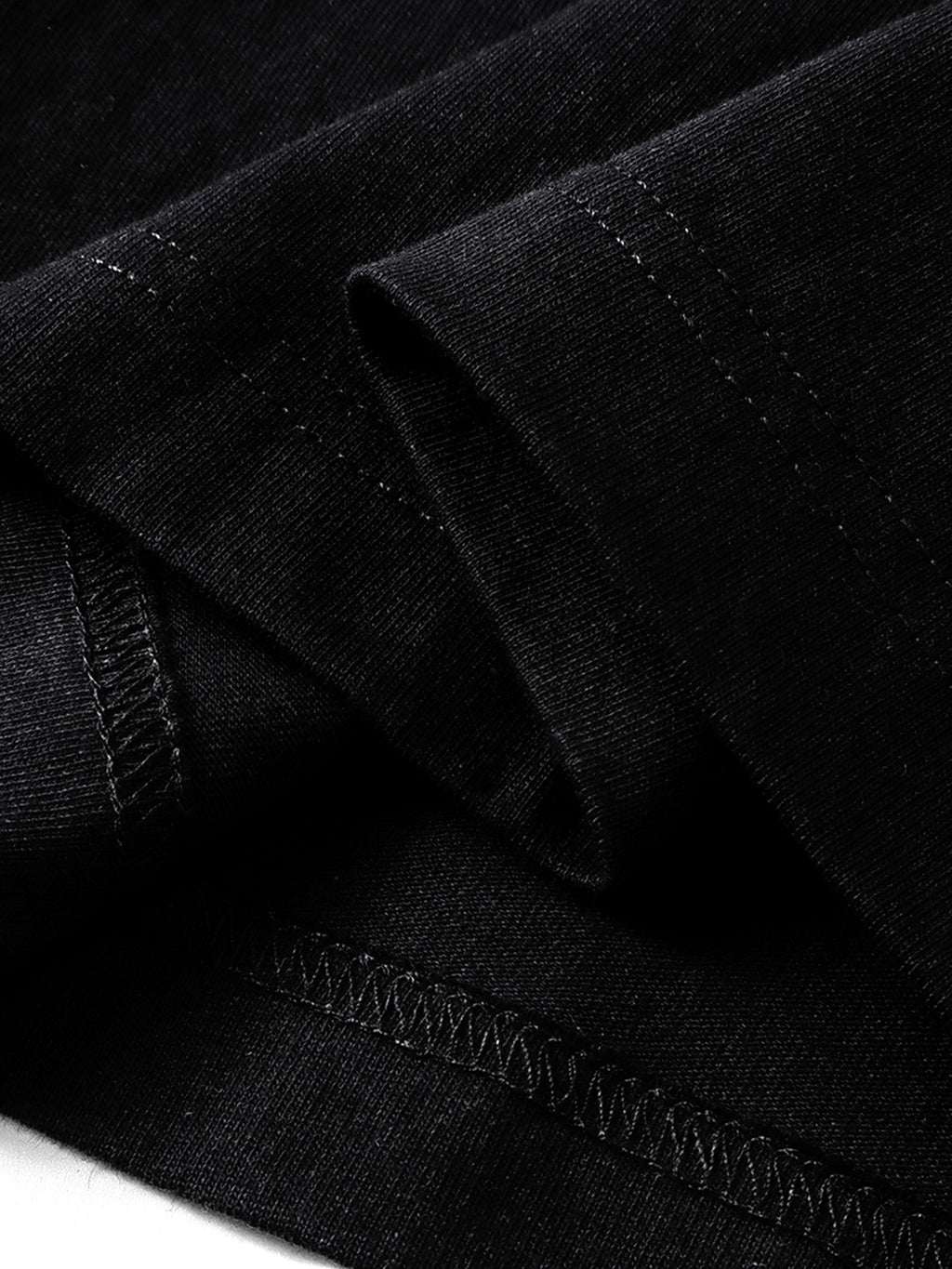 Black long-sleeve tee hem and overlock seam detail