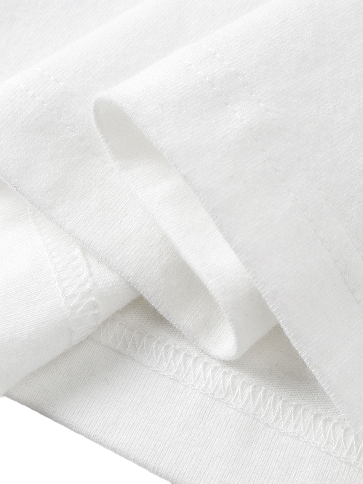 White long-sleeve tee hem seam detail