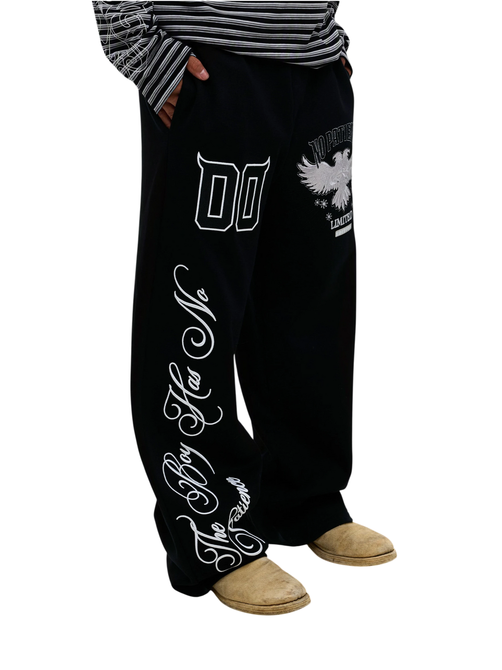 Model wearing black Luminous Dawn embroidered sweatpants, side view