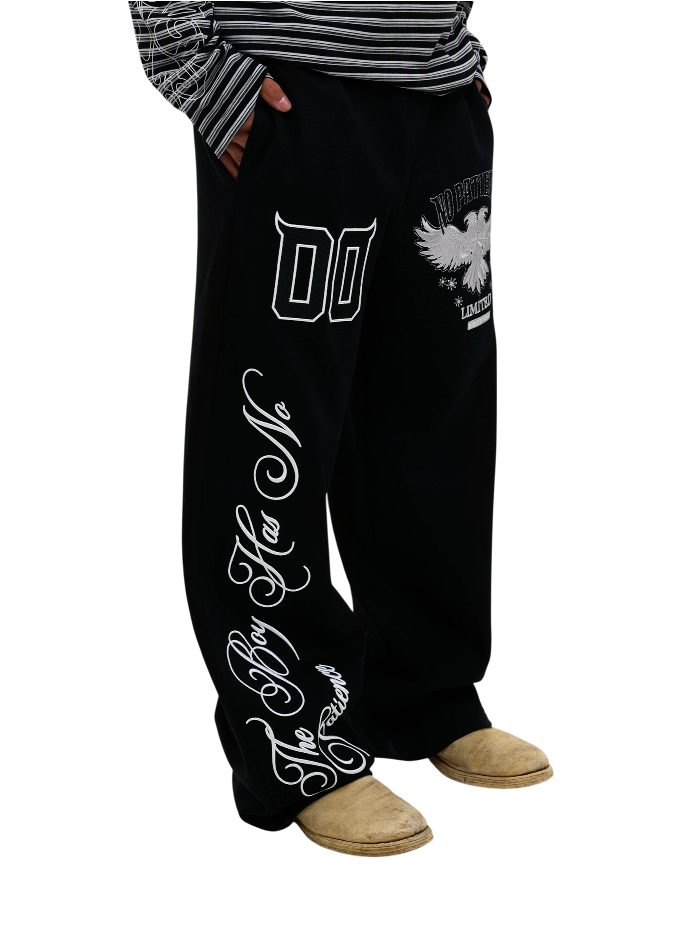 Model wearing black Luminous Dawn embroidered sweatpants, side view