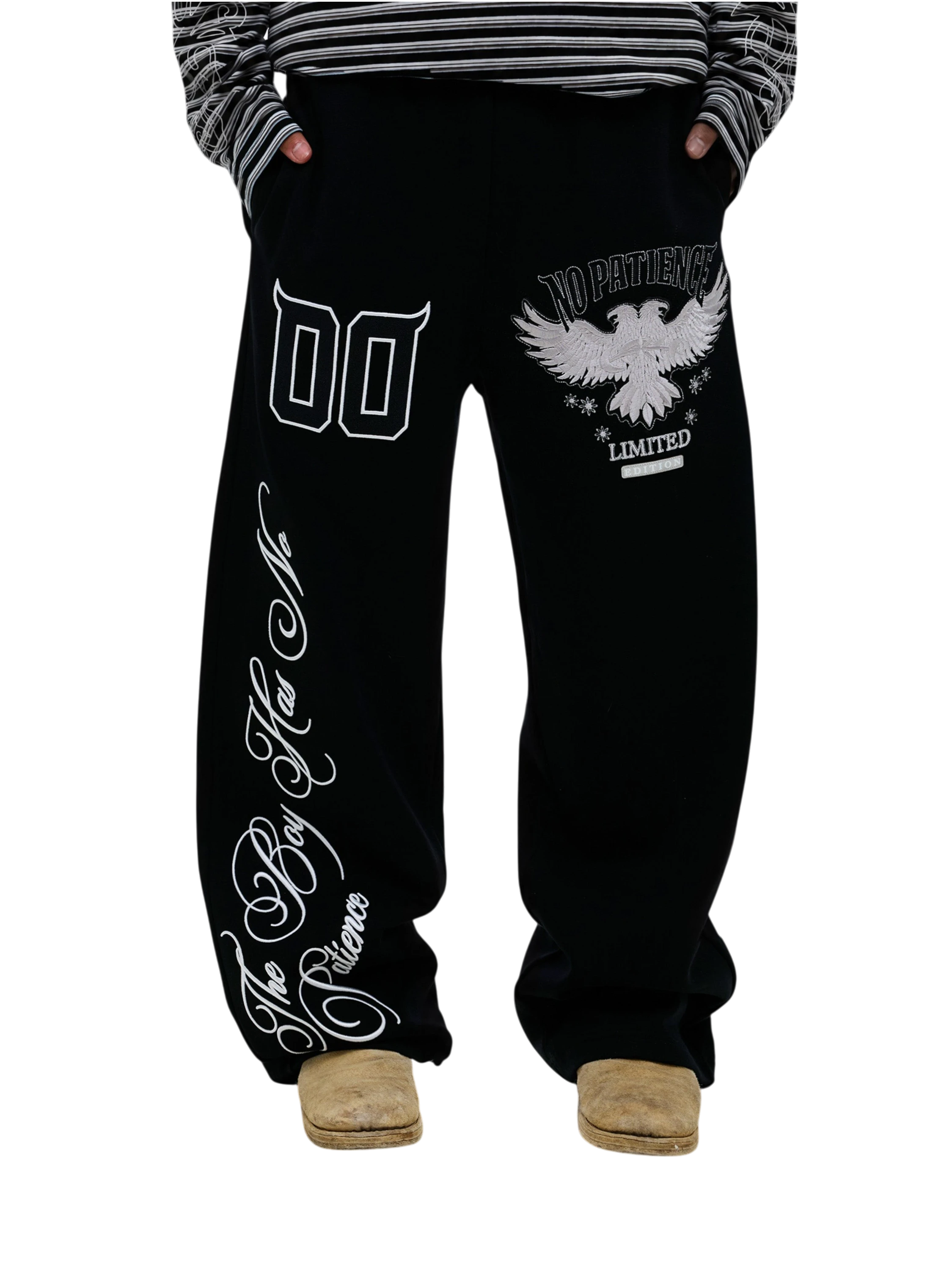 Model wearing black Luminous Dawn embroidered sweatpants, front view