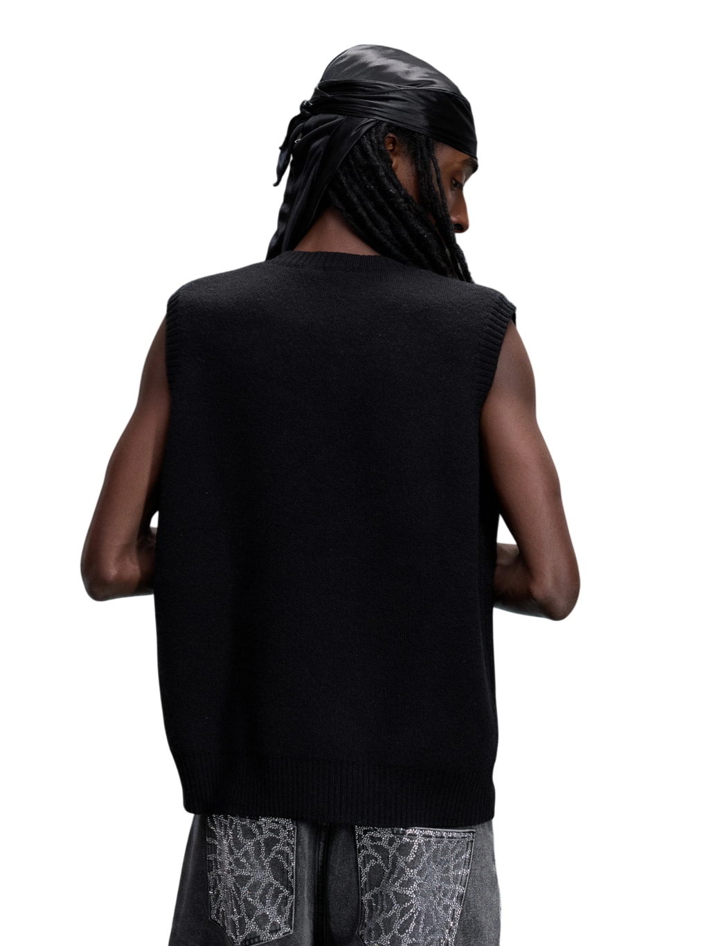 Model wearing the black Wraith Rhinestone Sweater Vest, back view.