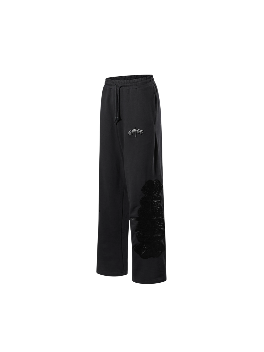 Close-up of the black pants embroidered leather panel.