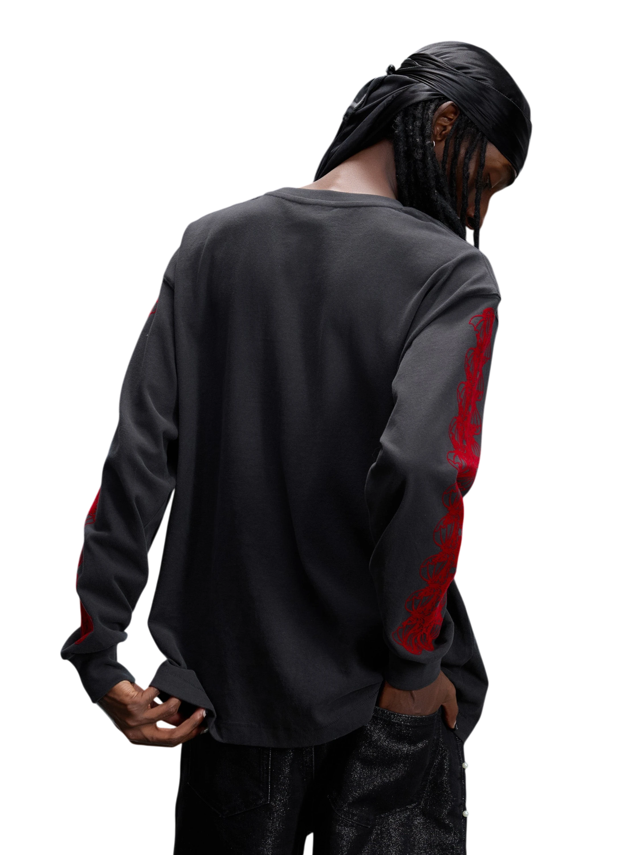 Model wearing Dark Grey flocked long-sleeve tee, back view